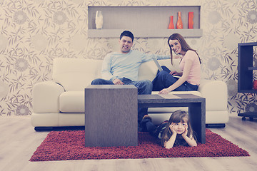 Image showing happy young family at home