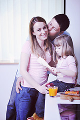 Image showing happy young family in kitchen