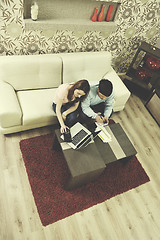 Image showing young couple working on laptop at home