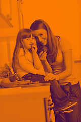 Image showing happy daughter and mom in kitchen