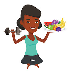 Image showing Healthy woman with fruits and dumbbell.