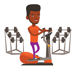 Image showing Man exercising on elliptical trainer.