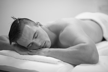 Image showing handsome man resting in a spa massage center