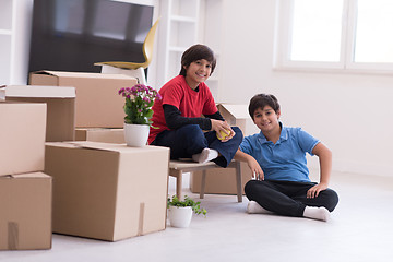 Image showing boys with cardboard boxes around them