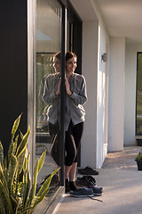 Image showing woman in front of her luxury home villa