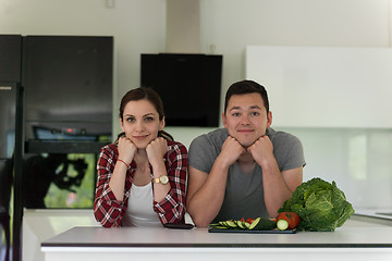 Image showing Young couple in the kitchen