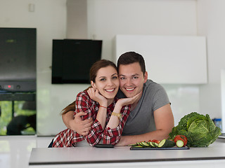 Image showing Young couple in the kitchen