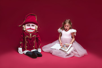 Image showing The beauty ballerina sitting with nutcracker