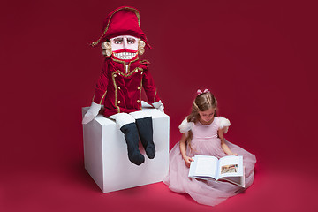 Image showing The beauty ballerina sitting with nutcracker