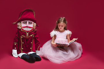 Image showing The beauty ballerina sitting with nutcracker