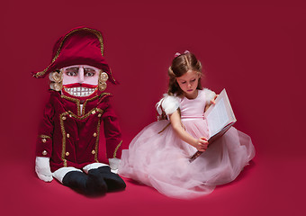 Image showing The beauty ballerina sitting with nutcracker