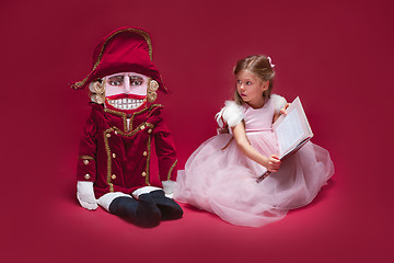 Image showing The beauty ballerina sitting with nutcracker