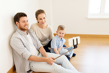 Image showing family taking selfie by smartphone at new home