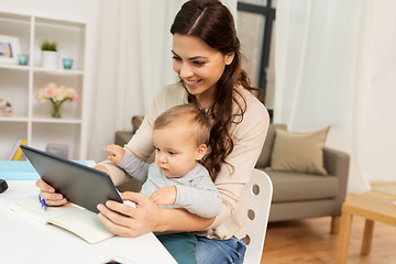 Image showing mother student with baby and tablet pc at home