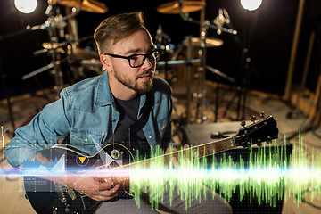 Image showing musician playing guitar at studio rehearsal