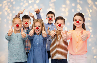 Image showing happy children showing thumbs up at red nose day