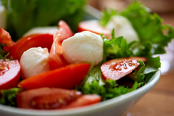 Image showing close up of vegetable salad with mozzarella