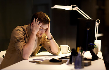 Image showing man with computer working late at night office