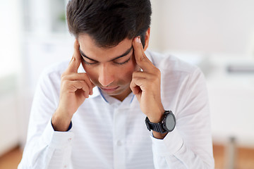 Image showing close up of stressed businessman at office