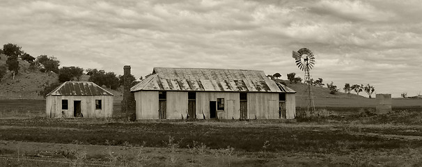 Image showing Rural farmlands windmill and outbuildings