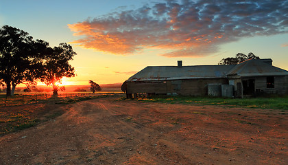 Image showing Farm buildings at sunset