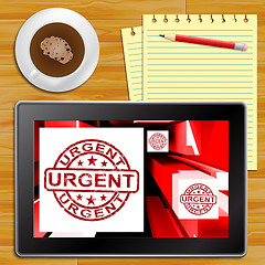 Image showing Urgent On Cubes Shows Urgent Priority Tablet