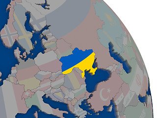 Image showing Ukraine with flag on globe