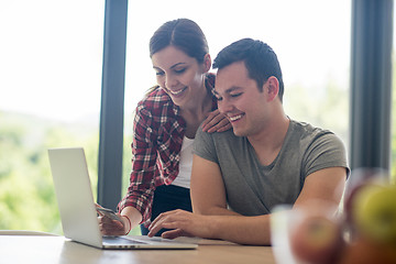 Image showing happy young couple buying online