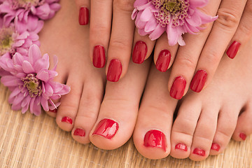 Image showing female feet and hands at spa salon