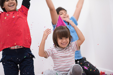 Image showing kids  blowing confetti