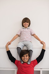 Image showing young boys posing line up piggyback