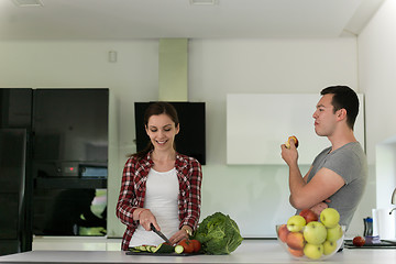 Image showing Young handsome couple in the kitchen