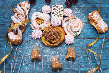 Image showing Different cookies on blue wooden