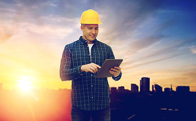 Image showing male builder in yellow hard hat with tablet pc