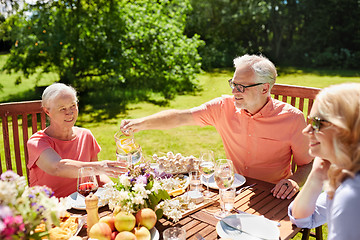 Image showing happy family having dinner or summer garden party