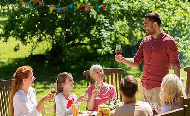 Image showing happy family having dinner or summer garden party