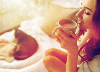 Image showing close up of happy woman with cocoa cup at home