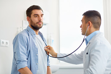 Image showing doctor with stethoscope and patient at hospital