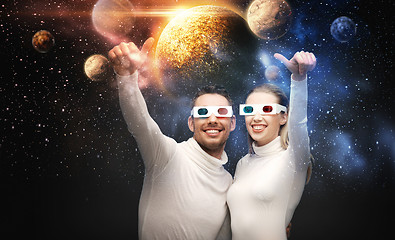 Image showing couple in 3d glasses looking at space projection