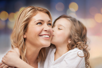 Image showing happy mother with daughter hugging and kissing