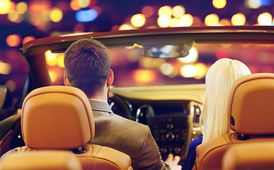 Image showing close up of couple driving in convertible car