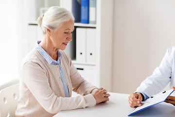 Image showing senior woman and doctor meeting at hospital