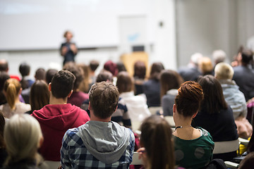 Image showing Woman giving presentation in lecture hall at university.