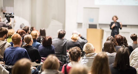 Image showing Woman giving presentation in lecture hall at university.