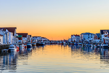 Image showing fishing fleet berthed at sunset