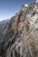 Image showing Ultralight plane flies over Pokhara and Machapuchare