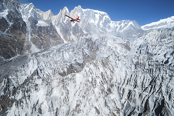 Image showing Ultralight plane flies over Pokhara and Machapuchare