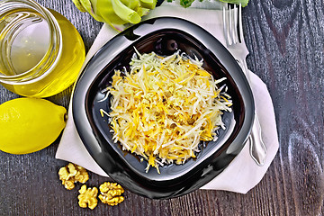 Image showing Salad of carrot and kohlrabi with honey in plate on board top