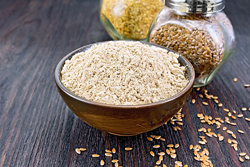 Image showing Flour linen in bowl with seeds in glass jars on table