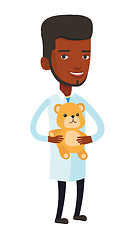 Image showing Pediatrician doctor holding teddy bear.